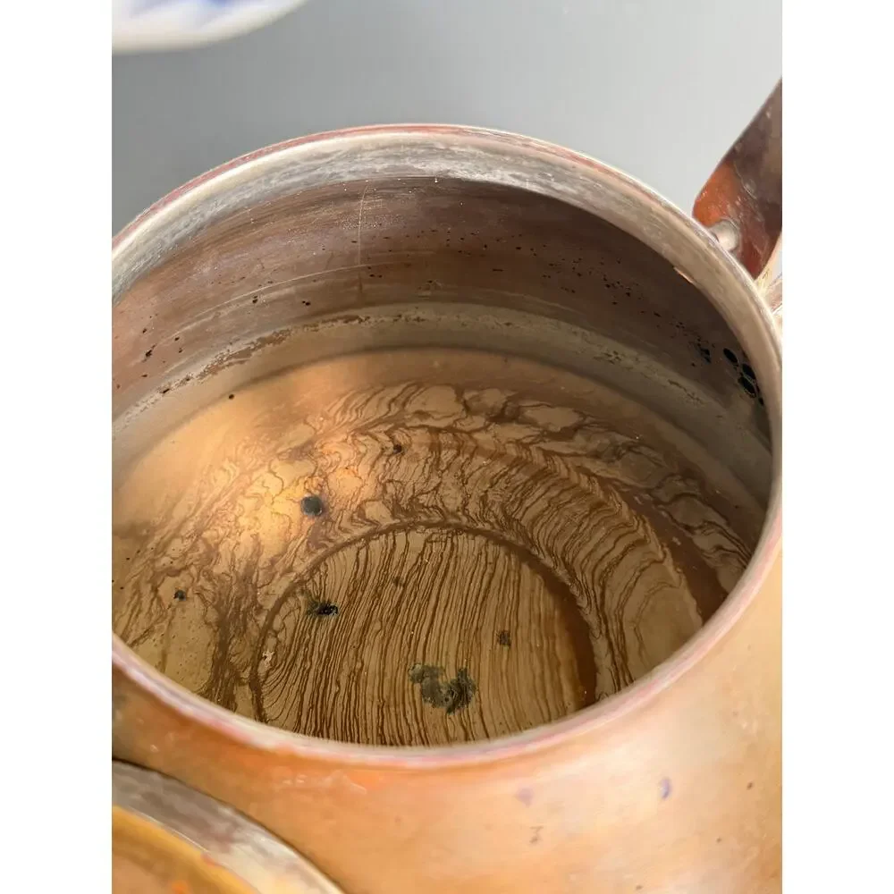 Vintage copper tea kettle with hand-painted blue and white porcelain handle lid